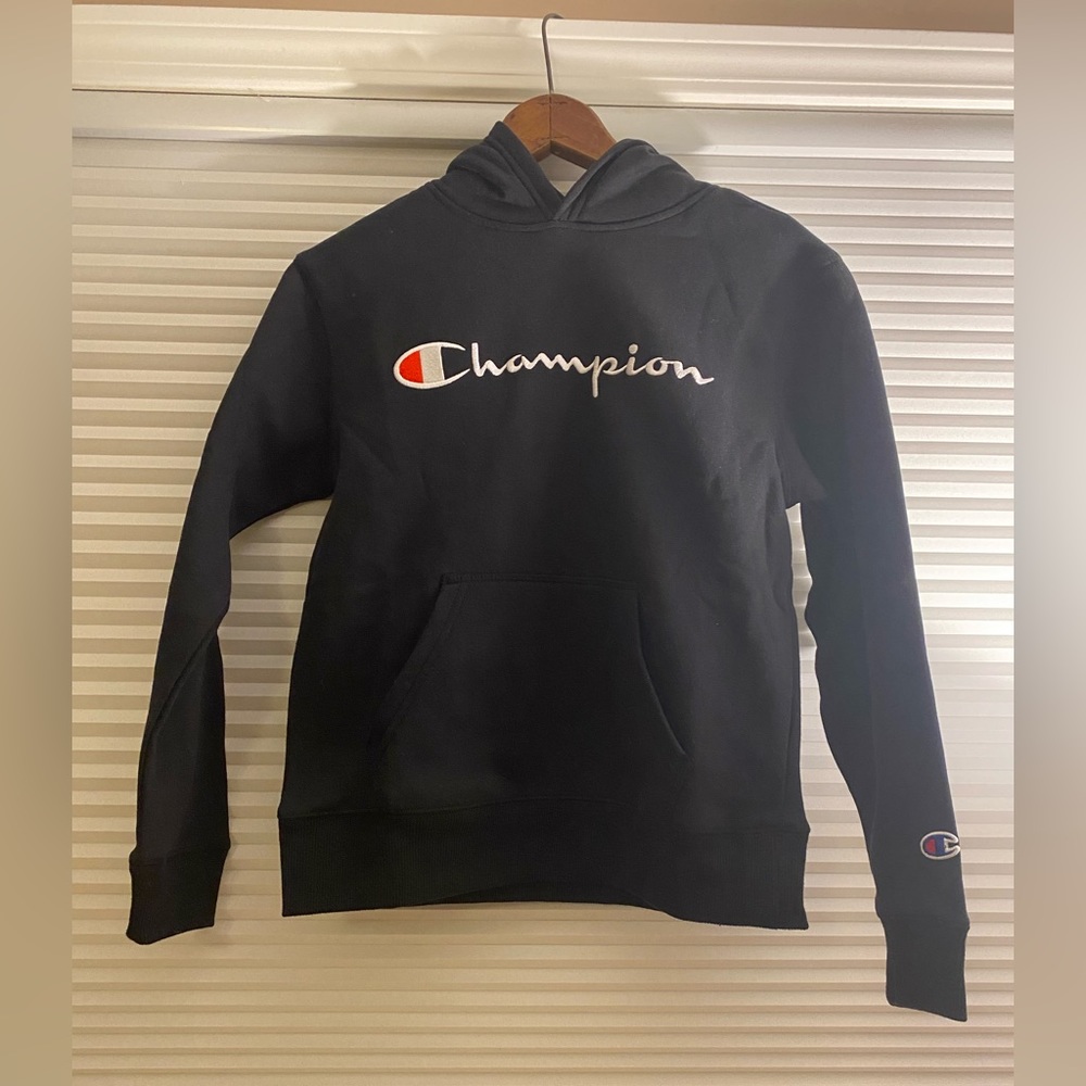 Child’s champion hoodie - size Medium